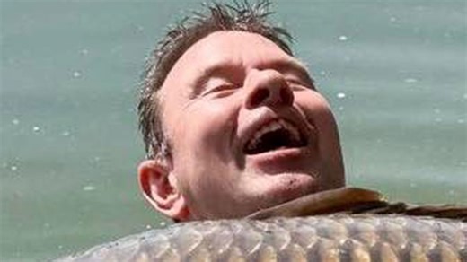 Angler in 'disbelief' after catching world's biggest carp weighing eight stone