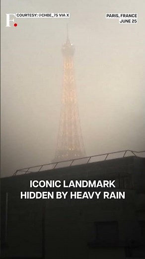 Watch: Eiffel Tower Covered In Clouds & Rain Amid Paris Storm | N18G