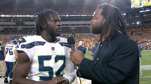 Michael Bennett Gives A Sideline Interview To DE Darell Taylor