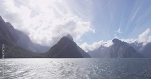 Milford Sound in Fiordland National Park and Mitre Peak, New Zealand. Iconic and famous New Zealand nature landscape seen from cruise ship. RED EPIC SLOW MOTION.