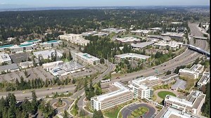 Cinematic aerial drone dolly video of the Microsoft Corporate Headquarters, Microsoft Commons, Microsoft Studio in Overlake and Redmond, Washington, near Bellevue, Seattle
