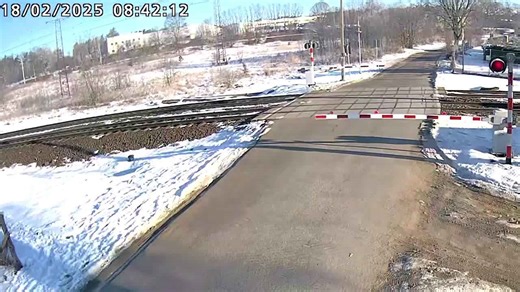 Train hits car that ignored level crossing barrier in Poland