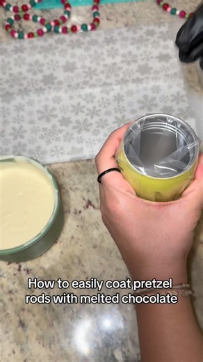 Candycoated.dip on Instagram: "One of my favorite treat-maker tricks for chocolate covered pretzel rods 🍫 Placing the piping bag inside a cup keeps the melted chocolate neat, mess-free, and ready for smooth coating. Simple steps like this make a huge difference when working with chocolate. #chocolatecovered #chocolatepretzels"