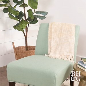 How To Reupholster A Chair: Give new life to an old piece of furniture with this DIY upholstery project! Get the how-to: https://trib.al/ZwcqIdJ | Better Homes & Gardens