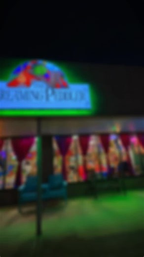 Our new sign is glowing and we’re loving how colorful and bright the shop becomes after dark ✨ Your local whimsy shop of wonders is shining bright, filled with unique treasures and sweets and treats from around the world. ✨ Open 10am–8pm 🐸💫 | The Dreaming Peddler