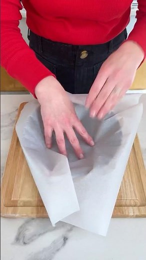 How to make a cartouche! Simple parchment trick for lining round cake pans. #baking #cake