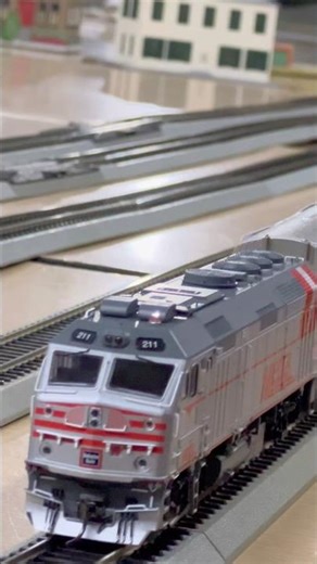 HO Scale Metra 211 Holiday Train going by during The Riverside Holiday Stroll.