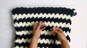 13K views · 134 reactions | No hooks or needles, just your hands! Create a two-toned criss-cross pillow and easily add bold designs to your home décor using Bernat Alize Blanket-EZ. Download the pattern here: https://www.yarnspirations.com/bernat-alize-ez-two-color-criss-cross-pillow/BRN0520-011887V.html | Yarnspirations | Facebook