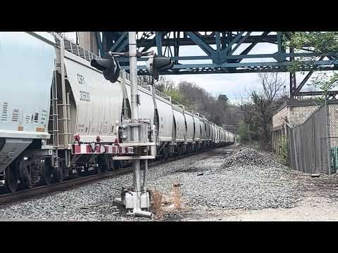 Canadian Pacific AC4400 and CSX ES44DC on a Norfolk southern grain train