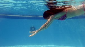 clip-1076703347-tourist-woman-swim-underwater-large-wading-pool