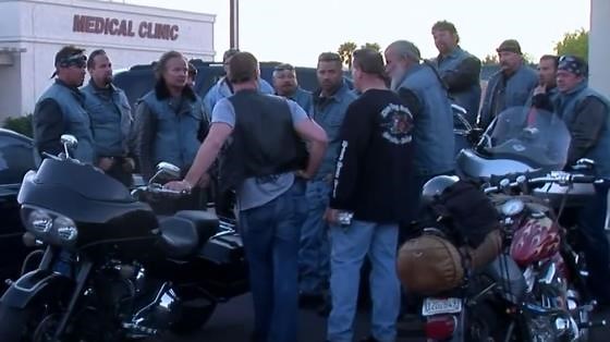 Changing into a new motorcycle club vest