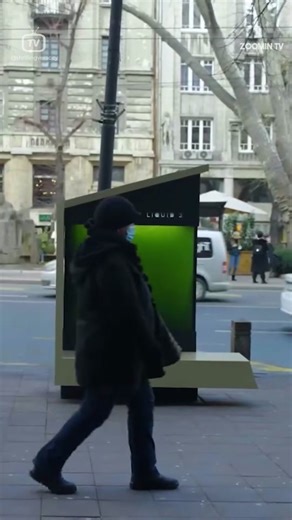 A liquid tree is an innovative device that uses microalgae to convert carbon dioxide into oxygen, just like plants do. It is a type of urban photo-bioreactor, which is a system that uses light and microorganisms to produce useful substances. A liquid tree consists of a glass tank filled with water and microalgae, and a solar panel that powers a pump that circulates air through the tank. The microalgae perform photosynthesis, which transforms CO2 and water into oxygen and biomass. A liquid tree c