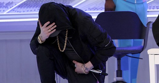 Eminem takes a knee during Super Bowl halftime performance
