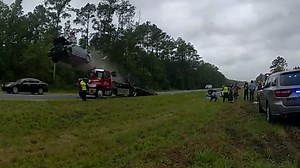 Driver sends car flying more than 100 feet after hitting parked tow truck ramp