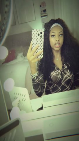 Soft curly hair glam with a chic mirror selfie look