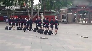Marking the fifth anniversary of the Foshan Shadi Airport, a group of stewardesses got together outside an ancient Chinese temple for a strange celebration. They performed a unique dance that left the crowd speechless. | CGTN