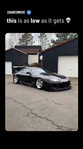 𝗗𝗮𝗿𝗲𝗗𝗿𝗶𝘃𝗲 on Instagram: "bros enemy: 🪨 This modified Toyota Supra takes the idea of “low life” to an almost absurd extreme, sitting so close to the asphalt that ground clearance is basically a myth. The viral clip perfectly shows just how wild the fitment is, with a simple credit card failing to slide under the side skirts, instantly getting jammed like the road itself is part of the build. Every angle screams dedication to stance culture, where millimeters matter and visual impact com