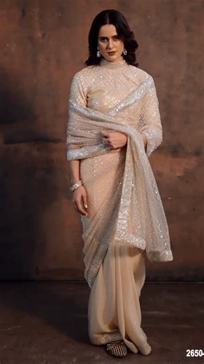 DULARI on Instagram: "• Design Number: 26504 • Color: Nude/Beige/Light Gold • Fabric: Crush Satin with Mono Net • Work Style: Beads & Dual Sequins Embellishment 📱 WhatsApp: +91 98981 14279 / +91 93135 94459 / +91 96649 68988 🛍️ Shop Online: dulariahmedabad.com 🎥 Live Video Call Shopping | 🌍 Worldwide Delivery 📍 Dulari, Raj Plaza Complex, Gurukul, Ahmedabad–380052 🔗 Map in Bio ✨ Follow @dulari.ahmedabad for Daily New Collections #sareelove #predrapedsaree #indowestern #sharara #plazo #chani