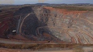 Aerial view drone fly over quarry mining industrial aggregate extraction minerals stone sunny day in England UK Europe