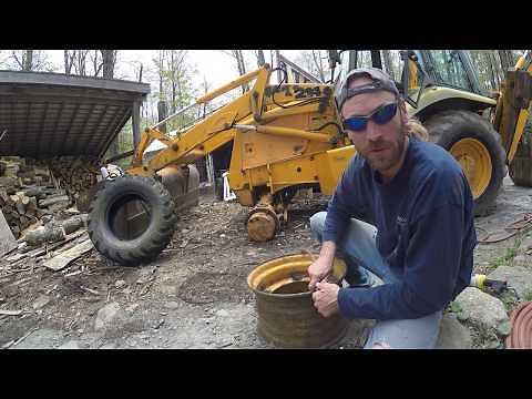 Changing a Backhoe loader Tire by hand!