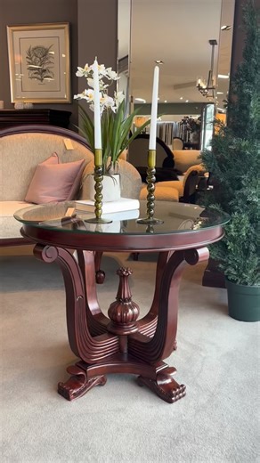 This mahogany table is a showstopper! It works as a coffee table or hall table, and the glass top and detailed, curved legs are so elegant. #trevormorrow #mahogany #interiordesign #coffeetable | Trevor Morrow Ltd