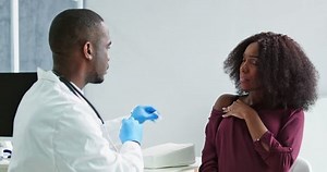 Doctor Making Covid-19 Vaccine Injection To Pregnant Woman Patient