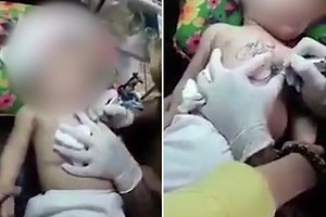 Shocking footage appears to show a terrified baby getting a TATTOO