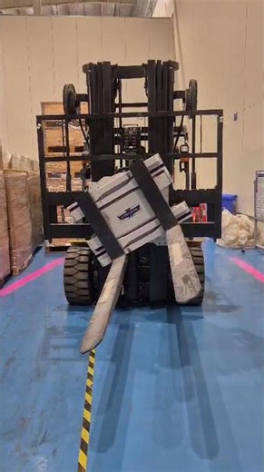 Cascade rotating fork attachment with fork positioner fitted on Godrej 5 Ton Electric Forklift Truck