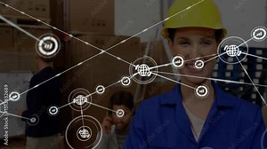 Warehouse engineer watching globe icon fading and forming nodes illustrating logistics connectivity