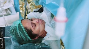 Doctor Performing Surgery Using Sterilized Equipment. Surgical Team Performing Surgery Operation. Gynecologists And Midwives Giving Birth. Infant In Maternity Hospital. Welcome To Motherhood