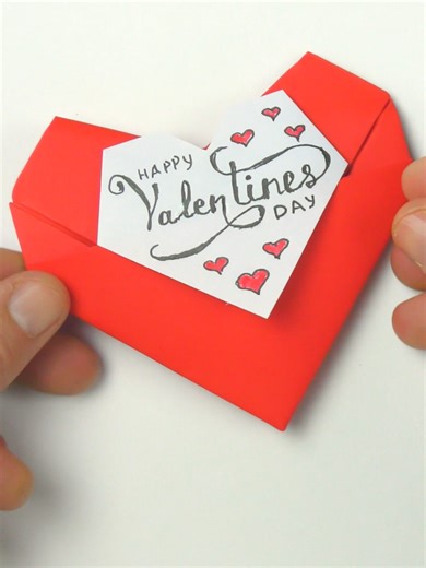 DIY Origami Heart Surprise! Paper Valentine Making Easy | Paper Heart Cute Card for Valentine's Day. Learn how to make a beautiful paper heart, perfect for Valentines Day. This easy origami tutorial provides step-by-step instructions on how to make an origami heart, guiding you through the simple folds to create a lovely heart origami. It's a fun DIY project for anyone wanting to create a thoughtful gift or decoration. #valentine #paperheart#14feb #origamitutorial #papercrafts #papercraft #diy #