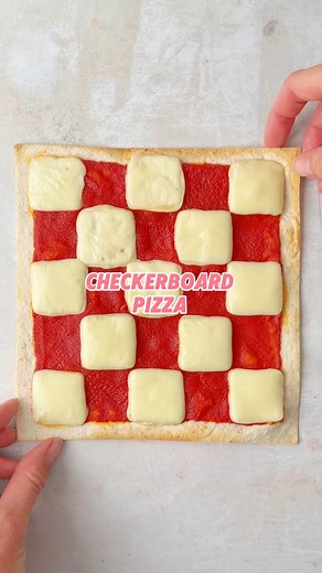 A fun & easy way to elevate your pizza! Cut a tortilla into a square, then spread with tomato sauce. Cut your cheese (I went for sliced Edam) into squares and arrange in a checkerboard pattern. Bake until the cheese has melted and enjoy! #funpizzaideas #checkerboard #checkerboardpizza #tortillapizzarecipe #cheeseandtomatopizza #squarepizza | The Fast Foodie