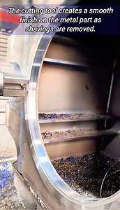 Large CNC machine cutting metal.