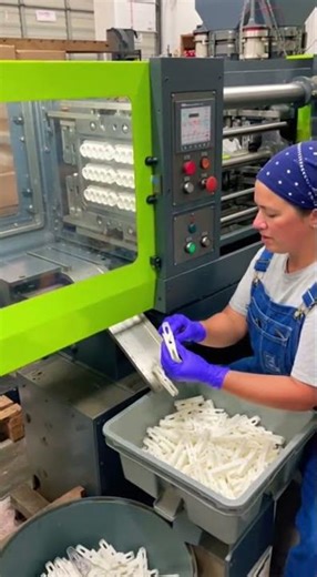 Woman Working by Plastic Injection Molding Machine for Clothespin Production