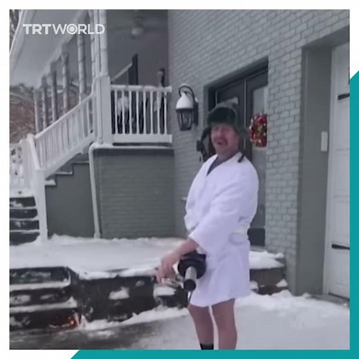 Man uses flamethrower to clear snow from driveway
