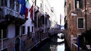 Colorful street in Venice, Italy. Colorful street of Venice. Canal in Venice Italy. Pedestrian bridge over a canal in Venice