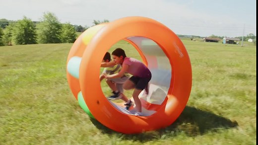 HearthSong Roll with It! 2.0 Giant Inflatable Rainbow Land Roller with Mesh Interior for Active Outdoor Play, 67" Outer Diam. x 45" Inner Diam., Holds up to 300 lbs.