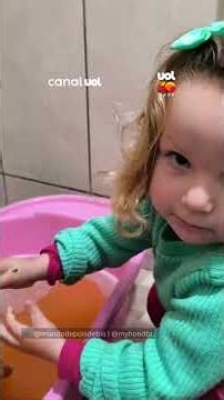 3-year-old girl gives duck a bath and scolds her mom