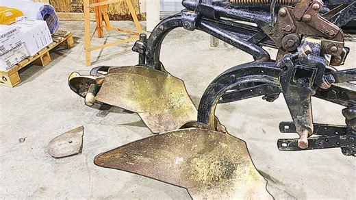 Farmer welding repairs on farming equipment