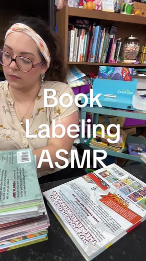 Adding labels to new library books to get them shelf ready! #schoollibrarian #graphicnovels #bookasmr #asmrsounds #asmr