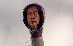 Long-missing, this cane's handle is carved with Jack the Ripper's creepy face