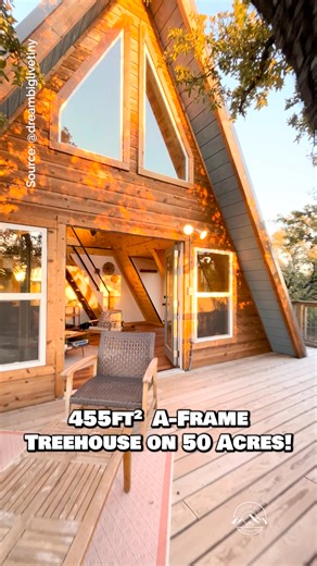 What do you think of this A-frame treehouse set on 50 acres? Would you live here? While this A-frame is technically a bit larger than a tiny house, it's still right in that sweet spot for those of you that want to downsize, but may not be able to go too tiny! Inside, there's a large living space with a couch & dining area, a kitchen, a full bathroom with a tile shower, a closet, & a loft bedroom! The outdoor living setup is one of my favorites with a hammock overlooking an incredible view of the