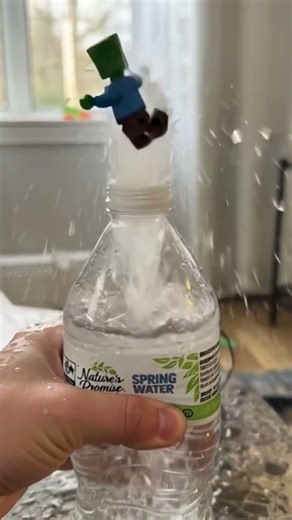 Lego Creeper dancing on Water bottle fountain