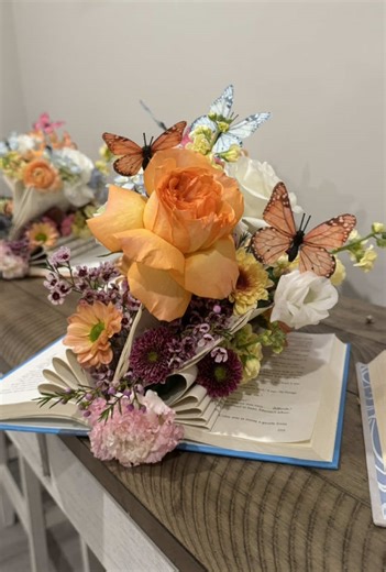 A New Chapter Begins… DIY book centerpieces 📚🌸🦋 #diy #books #bridalshower #newchapter #flowers