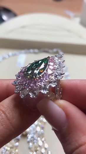 chameleon diamond is a natural phenomenon and this Novel Collection - Fancy Color Diamonds spectacular fancy green pear-shaped diamond displays chameleon characteristic which changes its color in different temperatures and lightings from green to yellow, gray and golden colors….here adorned by double constellation of pink and white diamonds for #MyLoveAffairWithDiamonds! #ChameleonDiamond #GrayDiamond #YellowDiamond #GreenDiamond #Brilliance #Scintillation #Sparkle #Fire #Bridal #EngagementRing