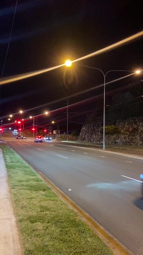 Nighttime Urban Street Scene with Vehicles