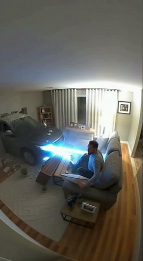 Car Crashes INTO Living Room While Man is Watching TV (CCTV Footage)