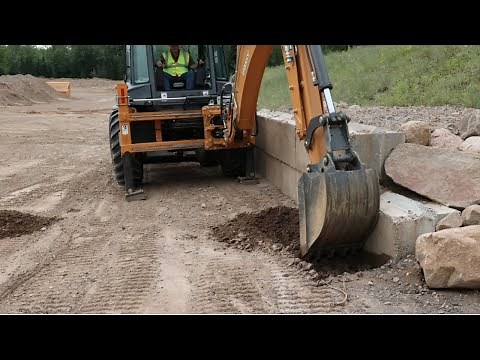 North America: For digging near walls and structures, nothing beats a CASE side shift backhoe