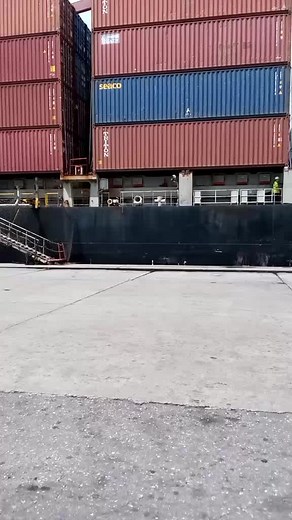 Cargo Ship Operations: Containers and Cranes at Port