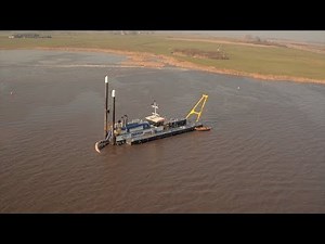 Cutter suction dredger mining sand for nearby road construction project